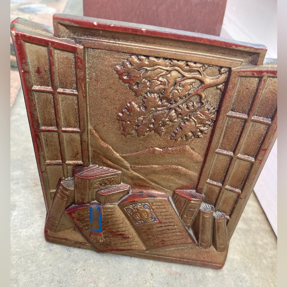 SET of Syroco wood bookend. Showing a scene of books and a cottage window. 1940s